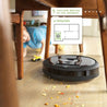 
iRobot-Roomba-i7-Wi-Fi-Connected-Robot-Vacuum-Cleaner-listing-under-table